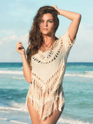 Young charming woman on the beach